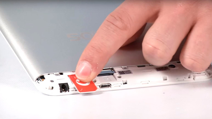 cheap 4G tablet with sim card being inserted into the slot