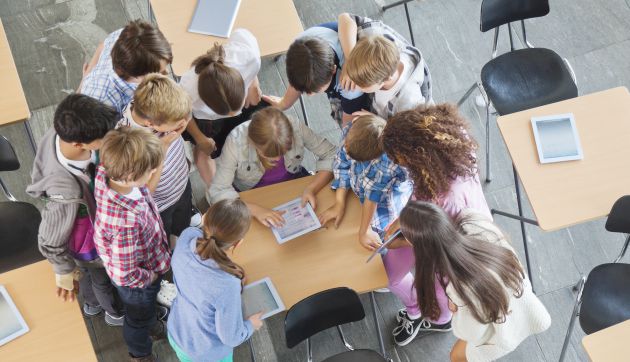 kids interacting with tablets in class