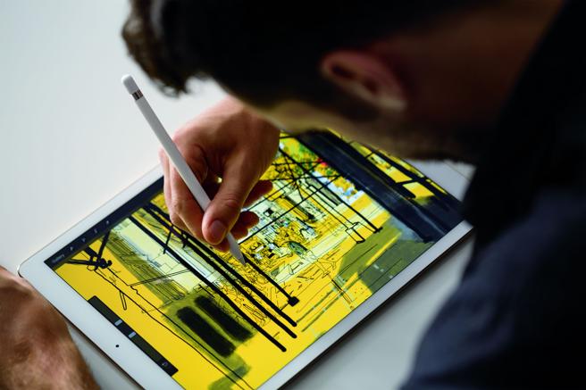 man working on an ipad