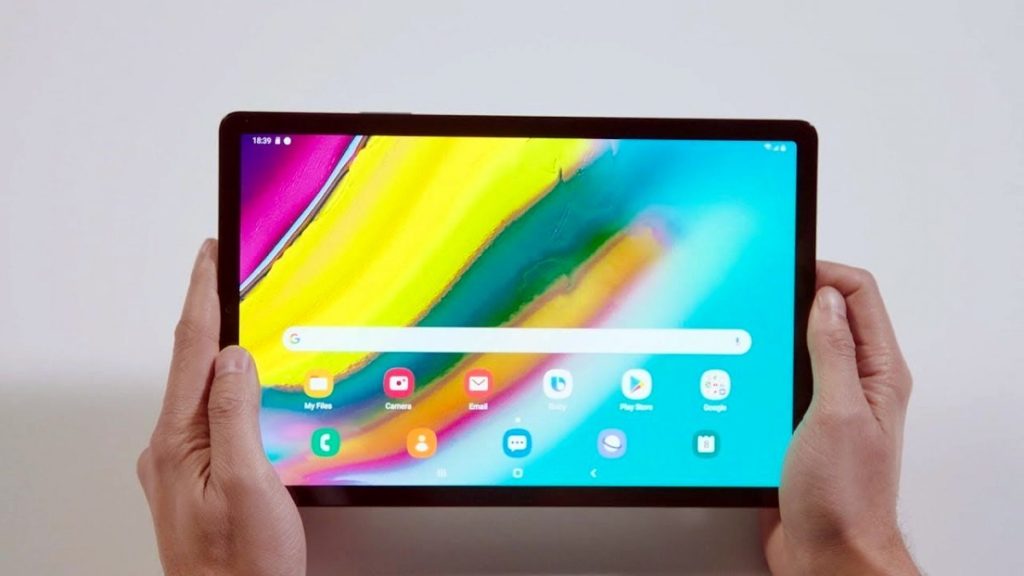 man holding galaxy tab s5e tablet